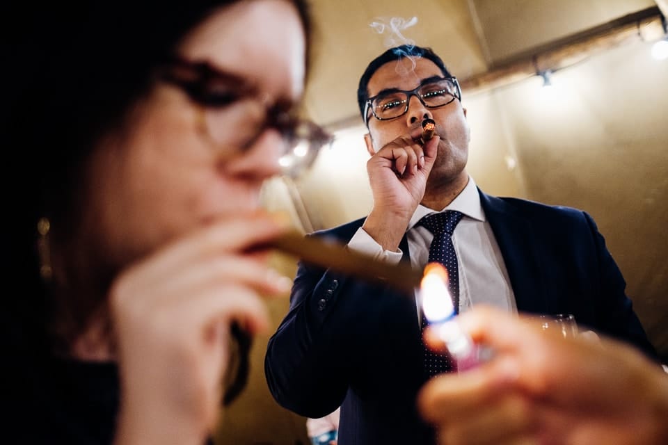 candid photo of cigar smoking
