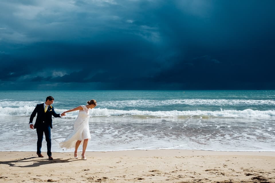 epic sky wedding couple beach