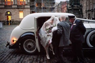 bride arriving in rolls royce wedding car