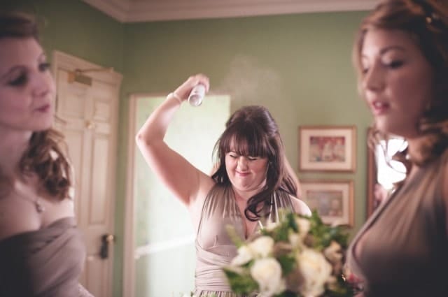 bridesmaid spraying hair London Alternative Candid Relaxed Fun Alternative Documentary Wedding Photography